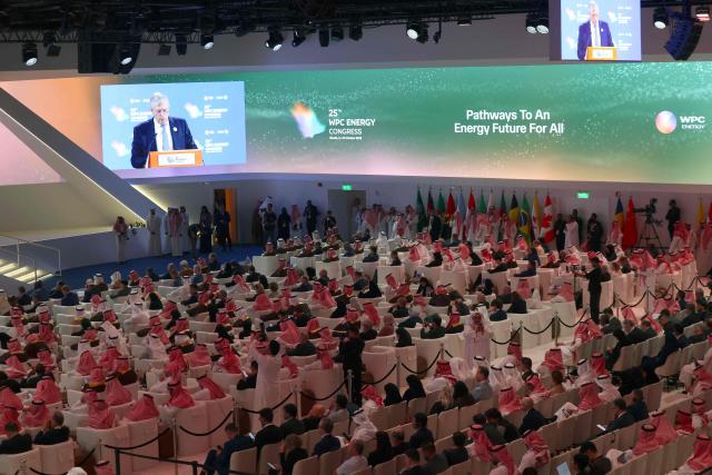 Guests attend the 25th WPC Energy Congress (World Petroleum Council) in Riyadh on October 12, 2026. On February 28, 2026, Israel and the United States launched strikes on Iran killing its supreme leader and triggering a war that spread across the Middle East and unleashed chaos across global markets and sent oil prices soaring. (Photo by Fayez Nureldine / AFP)