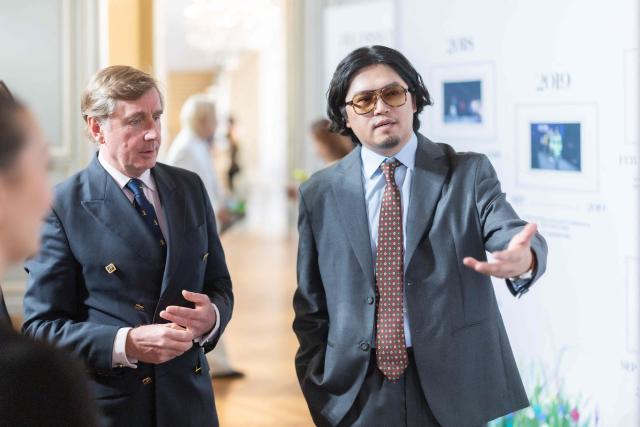 PARIS, FRANCE  OCTOBER 5, 2026: Jet Gao, Group Vice President and General Manager of International Business at Bosideng Group, speaks with a guest during Bosideng's 50th anniversary exhibition in Paris. The exhibition celebrates the Chinese fashion brand's five decades of history, innovation and international development, alongside Paris Fashion Week.

MediaConnect: https://mediaconnect.com/?p=533639&preview=true (Photo by BOSIDENG / MediaConnect) / Disclaimer: This document is neither produced nor endorsed by AFP. Although distributed by MediaConnect, its issuer remains solely responsible for its content Its reproduction is authorized in context without any distortion of content. If you have any question about this document, please contact its issuer.