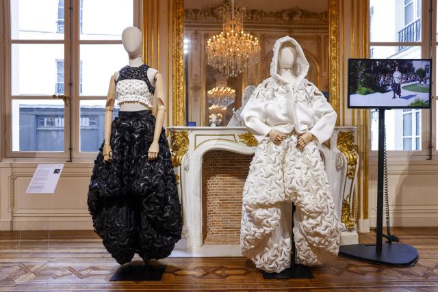 PARIS, FRANCE  OCTOBER 5, 2026: Two mannequins display black and white sculptural fashion creations at Bosideng's 50th anniversary exhibition in Paris, France. The exhibition celebrates the Chinese fashion brand's five decades of history, creativity and design, alongside its presentation of "The Bloom" during Paris Fashion Week.

Source :https://mediaconnect.com/?p=533639&preview=true (Photo by BOSIDENG / MediaConnect) / Disclaimer: This document is neither produced nor endorsed by AFP. Although distributed by MediaConnect, its issuer remains solely responsible for its content Its reproduction is authorized in context without any distortion of content. If you have any question about this document, please contact its issuer.