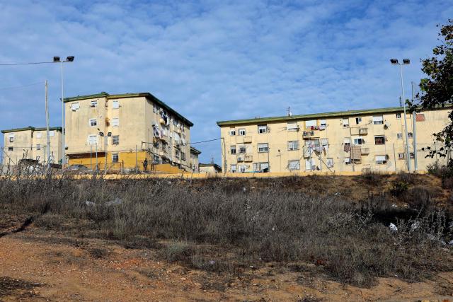 Principe Felipe neighbourhood's buildings are pictured in Spain's North African enclave of Ceuta on October 11, 2026. Spain's King Felipe VI and Queen Letizia are scheduled to visit Ceuta on October 13, 2026. The Spanish North African enclave of some 80,000 inhabitants seek to regain balance while hundreds of migrants remain in makeshifts camp after the massive influx of tens of thousands of migrants from Morocco in late July. (Photo by Thomas COEX / AFP)