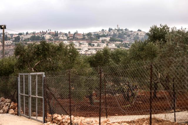 A Palestinian-owned olive grove is fenced in near the village of Turmus Ayya, north of the city of Ramallah, in the Israeli-occupied West Bank on October 12, 2026. The olive harvest starts in the West Bank in October and makes up a large component of the agricultural economy and cultural life for most Palestinians. Violence has flared in recent months in the West Bank with near-daily attacks, thefts or vandalism by Israeli settlers against Palestinians. Extremist Israeli settlers have been seizing olive groves owned by Palestinians, who see the trees as a cultural symbol. Some 500,000 Israeli settlers live in the West Bank, which Israel captured in 1967, among three million Palestinians. Settlements in occupied territory are illegal under international law.
 The olive harvest is a major component of the West Banks agricultural economy, rural livelihoods and cultural life. The Ministry of Agriculture estimates that around 750,000 dunums are planted with olive trees in the West Bank.  Olive trees make up about 45% to 48% of all agricultural land in the West Bank and Gaza, and account for roughly 70% of fruit production. (Photo by Zain JAAFAR / AFP)