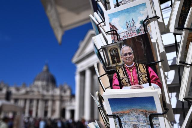 Postcards of Pope Leo XIV are on sale at a souvenirs shop near St Peter's square in the Vatican on October 12, 2026. Pope Leo XIV has said on October 11, 2026 he will have an operation to remove a lump on his lung this week, the first time a pope has made a personal medical announcement of this kind. (Photo by Tiziana FABI / AFP)