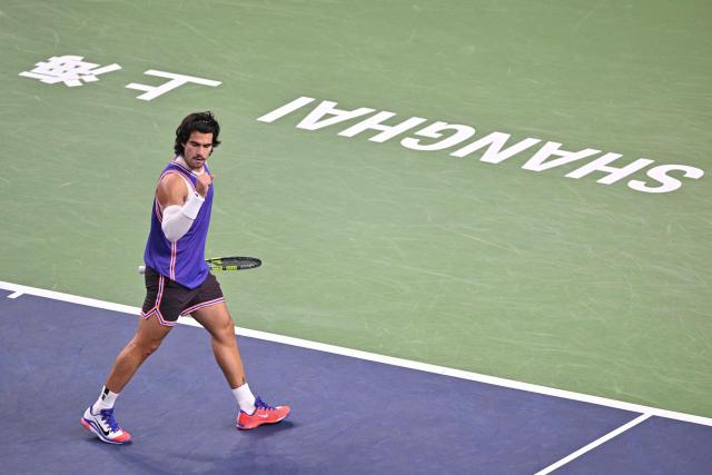 Spain's Carlos Alcaraz celebrates a point against Belgium's Zizou Bergs during their men's singles match at the Shanghai Masters tennis tournament in Shanghai on October 12, 2026. (Photo by Hector RETAMAL / AFP)