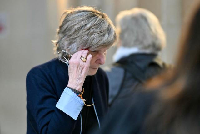 Celebrity press agent Mimi Marchand arrives at the Paris courthouse for the appeal hearing in her case involving the alleged extortion of French television presenter Karine Le Marchand, in Paris, on October 12, 2026. (Photo by LOU BENOIST / AFP)