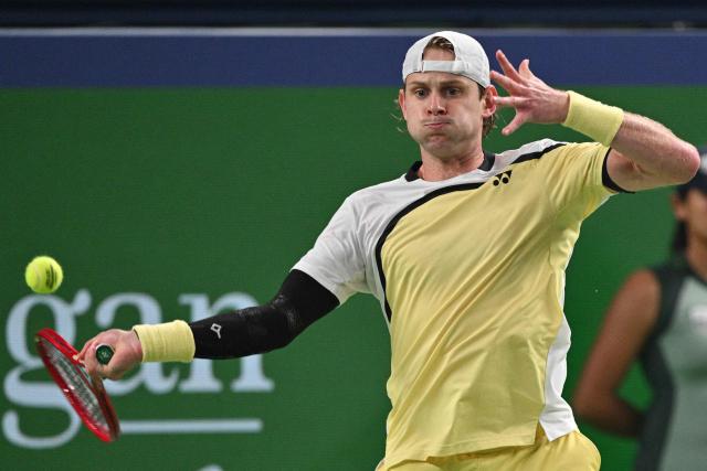 Belgium's Zizou Bergs hits a return to Spain's Carlos Alcaraz during their men's singles match at the Shanghai Masters tennis tournament in Shanghai on October 12, 2026. (Photo by Hector RETAMAL / AFP)