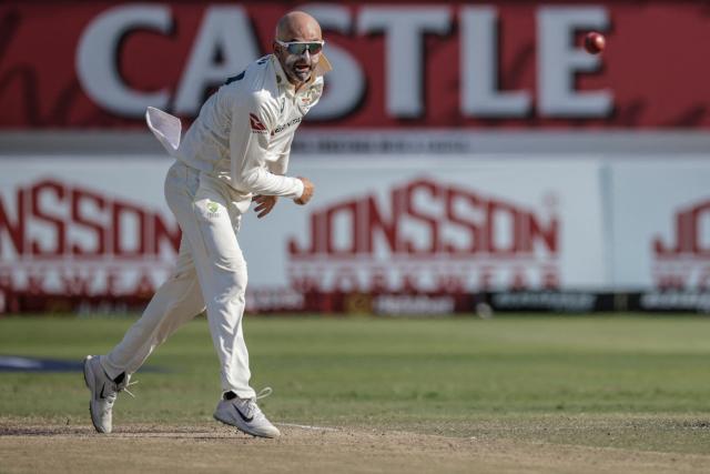 Australia's Nathan Lyon delivers a ball on day four of the first Test match between South Africa and Australia at the Kingsmead stadium in Durban on October 12, 2026. (Photo by Marco Longari / AFP)