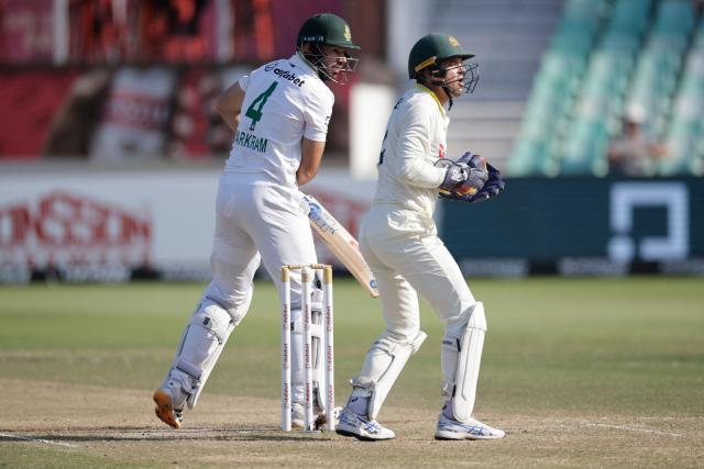 South Africa's Aiden Markram watches the ball after playing a shot on day four of the first Test match between South Africa and Australia at the Kingsmead stadium in Durban on October 12, 2026. (Photo by Marco Longari / AFP)