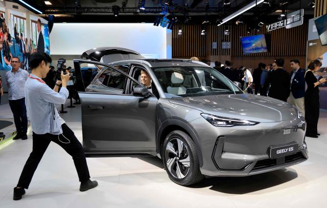 This photograph shows the Geely E5 SUV electric car at the 91st edition of the international Paris Motor Show at the Porte de Versailles in Paris on October 12, 2026. (Photo by Ludovic MARIN / AFP)
