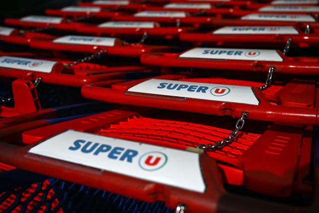 (FILES) This photograph shows a Super U supermarket logo on caddies in Beziers, Southern France, taken on September 24, 2026. Major French supermarket chains Intermarche and Cooperative U were hit by a cyberattack that caused their refrigerators to defrost, the two retailers told AFP on October 12, 2026. Some 150-200 Intermarche shops were targeted, along with almost 100 Cooperative U outlets, in the attack, they said. BFM TV said France's largest supermarket chain E. Leclerc was also affected, with hackers "managing to remotely trigger the forced defrosting of the refrigeration systems in numerous stores". Contacted by AFP, E. Leclerc did not immediately confirm the information. (Photo by Gabriel BOUYS / AFP)