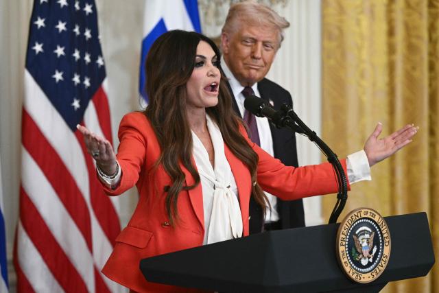 (FILES) Kimberly Guilfoyle, President Trump's nominee to be the US ambassador to Greece, speaks alongside US President Donald Trump, during a Greek Independence Day celebration in the East Room of the White House in Washington, DC, on March 24, 2025. US President Donald Trump and Secretary of State Marco Rubio are considering firing the US ambassador to Greece, Kimberly Guilfoyle, who has come under pressure following a series of damaging revelations, American media has reported. Trump is expected to decide soon on the fate of his eldest son Donald Trump Jr.'s former fiancee, CNN reported on October 11, 2026. In recent days, the Wall Street Journal has published a series of highly embarrassing articles about the former Fox News host, who became a prominent figure in Trump's Make America Great Again movement. (Photo by Brendan SMIALOWSKI / AFP)