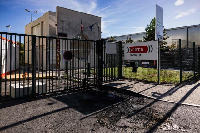This photograph taken on October 12, 2026, shows the entrance of the Francois Arago high school, where students carried out a blocking protest in Reims, northeastern France. In Reims, two members of the reception staff at Franзois Arago high school were injured by fireworks mortar rounds, according to multiple sources. “At least eight education staff members” were injured on the morning of October 12, 2026, amid protests by the high school student movement, the ministry said, noting that this figure did not include the middle school principal and the teacher injured by a shotgun blast in Aubagne. (Photo by Sameer Al-DOUMY / AFP)