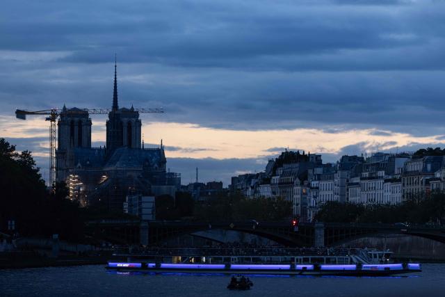 his photograph shows a Bateaux Mouches cruise boat on the Seine River, with Notre-Dame Cathedral in the background, in Paris on October 11, 2026. (Photo by JOEL SAGET / AFP)