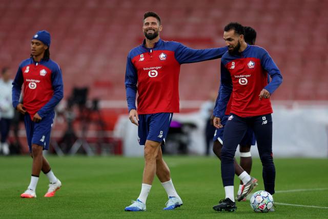 Lille's French striker #09 Olivier Giroud and Lille's Algerian midfielder #06 Nabil Bentaleb (R) attend a team training session at the Emirates stadium in London, on October 12, 2026, on the eve of their UEFA Champions League football match against Arsenal. (Photo by Adrian Dennis / AFP)
