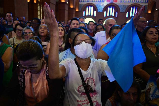 Catholic devotees attend celebrations marking Our Lady of Aparecida Day at the Basilica of the National Shrine of Our Lady of Aparecida, Brazil's patron saint, in Aparecida, Sao Paulo state, Brazil, on October 12, 2026. (Photo by Pablo PORCIUNCULA / AFP)