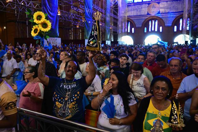 Catholic devotees attend celebrations marking Our Lady of Aparecida Day at the Basilica of the National Shrine of Our Lady of Aparecida, Brazil's patron saint, in Aparecida, Sao Paulo state, Brazil, on October 12, 2026. (Photo by Pablo PORCIUNCULA / AFP)