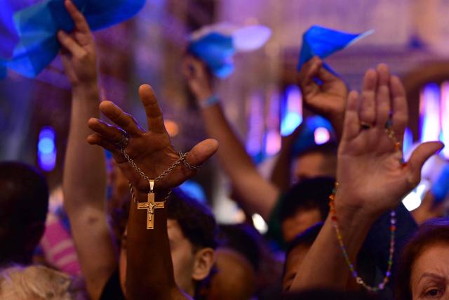 Catholic devotees attend celebrations marking Our Lady of Aparecida Day at the Basilica of the National Shrine of Our Lady of Aparecida, Brazil's patron saint, in Aparecida, Sao Paulo state, Brazil, on October 12, 2026. (Photo by Pablo PORCIUNCULA / AFP)