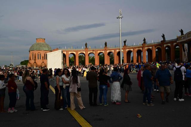 Catholic devotees arrive for celebrations marking Our Lady of Aparecida Day at the Basilica of the National Shrine of Our Lady of Aparecida, Brazil's patron saint, in Aparecida, Sao Paulo state, Brazil, on October 12, 2026. (Photo by Pablo PORCIUNCULA / AFP)