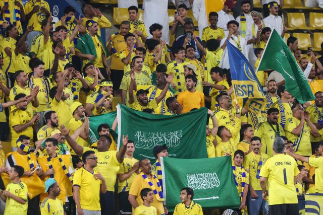 Al-Nassr's supporters cheer for their team prior to the AFC Champions League group B football match between Al-Nassr and Neftchi Fergana at Alawwal Park stadium in Riyadh on October 12, 2026. (Photo by Fayez NURELDINE / AFP)
