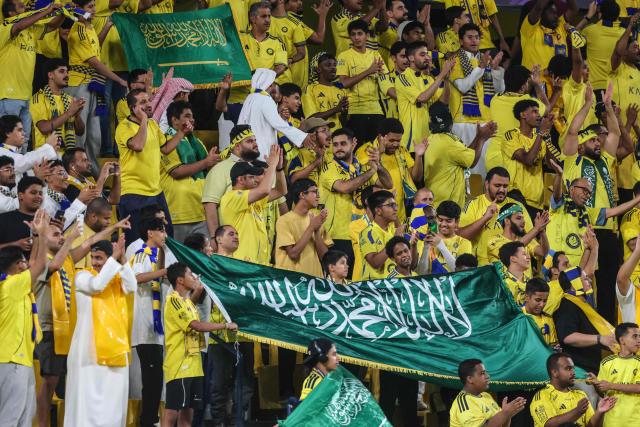 Al-Nassr's supporters cheer for their team prior to the AFC Champions League group B football match between Al-Nassr and Neftchi Fergana at Alawwal Park stadium in Riyadh on October 12, 2026. (Photo by Fayez NURELDINE / AFP)