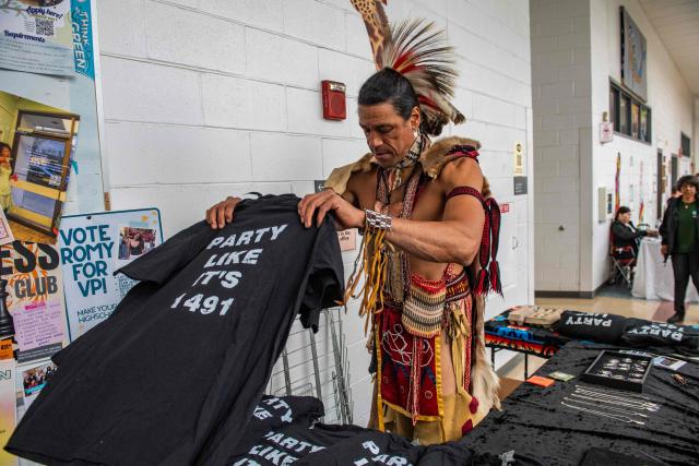 A vendor sells shirts with the message "Party like its 1491"  during an Indigenous People's Day event in Newton, Massachusetts, October 12, 2026. (Photo by JOSEPH PREZIOSO / AFP)