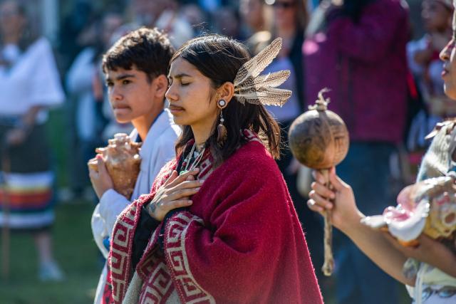 People participate in the opening ceremony of an Indigenous People's Day event in Newton, Massachusetts, October 12, 2026. (Photo by JOSEPH PREZIOSO / AFP)