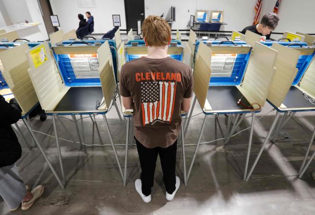 A voter fills out his ballot for the 2026 US midterm election at the Summit County Board of elections in Akron, Ohio, on October 12, 2026. Americans voting in the November 3 midterm elections will decide who controls Congress for the final two years of Donald Trump's presidency, along with dozens of governorships and thousands of state offices. (Photo by David MAXWELL / AFP)
