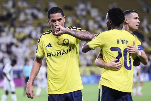 Nassr's Brazilian Forward #20 Angelo Gabriel (L) celebrates scoring his team's first goal during the AFC Champions League group B football match between Al-Nassr and Neftchi Fergana at the Alawwal Park stadium in Riyadh on October 12, 2026. (Photo by Fayez NURELDINE / AFP)