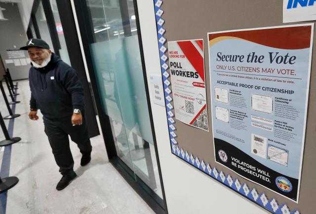 A voter exits the polling place after casting his ballot in the United States midterm election at the Summit County Board of elections in Akron, Ohio, on October 12, 2026. Americans voting in the November 3 midterm elections will decide who controls Congress for the final two years of Donald Trump's presidency, along with dozens of governorships and thousands of state offices. (Photo by David MAXWELL / AFP)