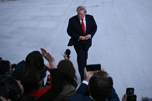 US President Donald Trump speaks to the press before boarding Marine One as he departs from the South Lawn of the White House in Washington, DC, on October 12, 2026. Trump is traveling to Youngstown, Ohio, to hold a campaign rally ahead of the midterm elections. (Photo by Brendan SMIALOWSKI / AFP)