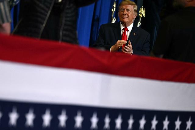 US President Donald Trump arrives to the stage to speak during a campaign rally at the Covelli Centre in Youngstown, Ohio, on October 12, 2026. (Photo by Kent NISHIMURA / AFP)