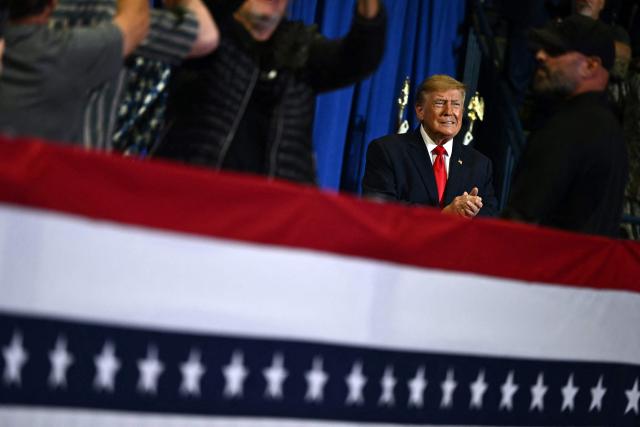 US President Donald Trump arrives to the stage to speak during a campaign rally at the Covelli Centre in Youngstown, Ohio, on October 12, 2026. (Photo by Kent NISHIMURA / AFP)