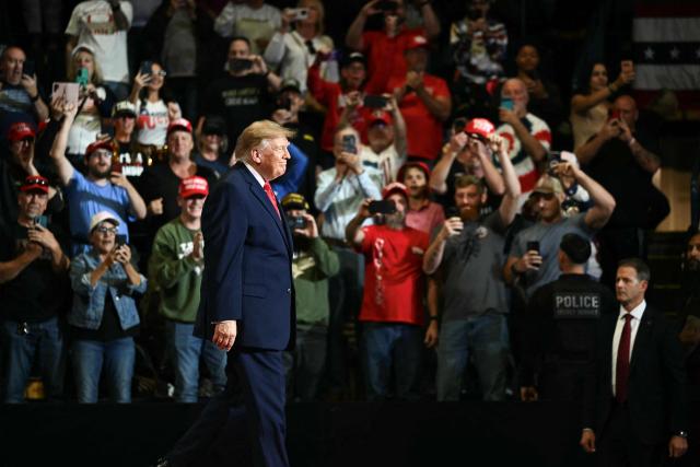 US President Donald Trump arrives to speak during a campaign rally at the Covelli Centre in Youngstown, Ohio, on October 12, 2026. (Photo by Kent NISHIMURA / AFP)