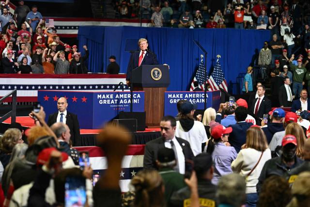 US President Donald Trump pauses his speech as a protester is removed from the venue during a campaign rally at the Covelli Centre in Youngstown, Ohio, on October 12, 2026. (Photo by Kent NISHIMURA / AFP)