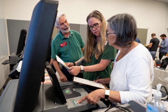 Volunteers attend voter machine training ahead of the midterm elections, in Charlotte, North Carolina, on October 12, 2026. Americans voting in the November 3 midterm elections will decide who controls Congress for the final two years of Donald Trump's presidency, along with dozens of governorships and thousands of state offices. (Photo by Amy Stewart / AFP)