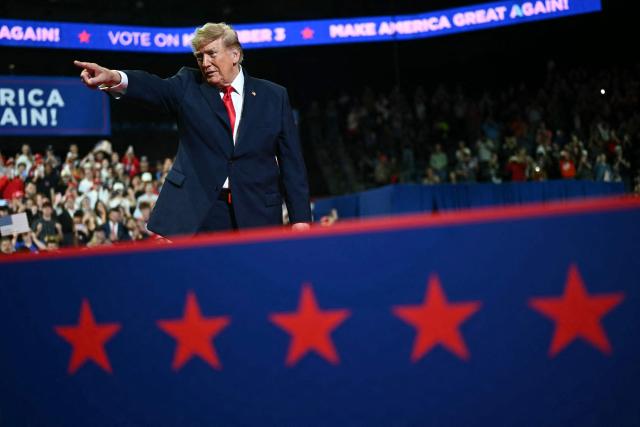 US President Donald Trump gestures during a campaign rally at the Covelli Centre in Youngstown, Ohio, on October 12, 2026. (Photo by Kent NISHIMURA / AFP)