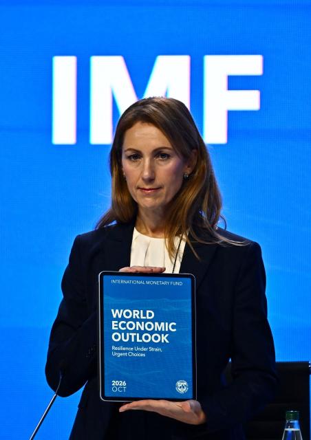 IMF Chief Economist Silvana Tenreyro holds the World Economic Outlook report during the World Economic Outlook press briefing at the Annual Meetings of the International Monetary Fund (IMF) and the World Bank Group (WBG) at the Queen Sirikit National Convention Center (QSNCC) in Bangkok on September 13, 2026. (Photo by Lillian SUWANRUMPHA / AFP)