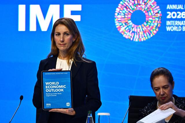 IMF Chief Economist Silvana Tenreyro holds the World Economic Outlook report during the World Economic Outlook press briefing at the Annual Meetings of the International Monetary Fund (IMF) and the World Bank Group (WBG) at the Queen Sirikit National Convention Center (QSNCC) in Bangkok on September 13, 2026. (Photo by Lillian SUWANRUMPHA / AFP)