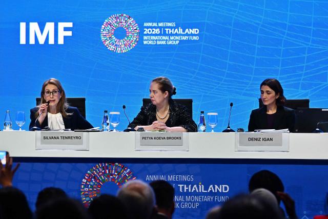IMF Chief Economist Silvana Tenreyro (L) speaks next to IMF Research Department Deputy Director Petya Koeva Brooks (C) and IMF Research Department Division Chief Deniz Igan (R) during the World Economic Outlook press briefing at the Annual Meetings of the International Monetary Fund (IMF) and the World Bank Group (WBG) at the Queen Sirikit National Convention Center (QSNCC) in Bangkok on September 13, 2026. (Photo by Lillian SUWANRUMPHA / AFP)