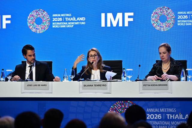 IMF Chief Economist Silvana Tenreyro (C) speaks next to IMF Research Department Deputy Director Petya Koeva Brooks (R) and IMF Communications Officer Jose Luis De Haro (L) during the World Economic Outlook press briefing at the Annual Meetings of the International Monetary Fund (IMF) and the World Bank Group (WBG) at the Queen Sirikit National Convention Center (QSNCC) in Bangkok on September 13, 2026. (Photo by Lillian SUWANRUMPHA / AFP)