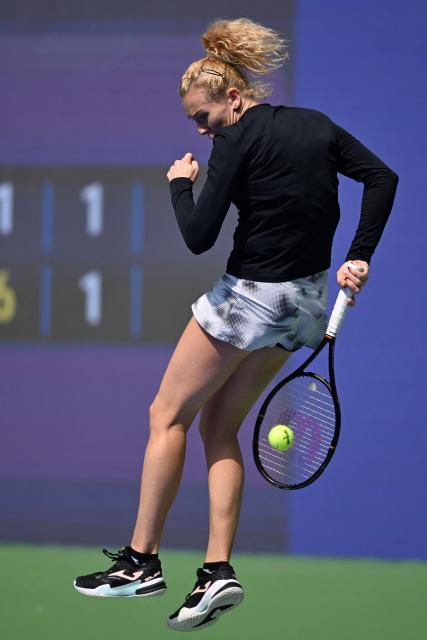 Czech Republic's Katerina Siniakova hits a return to Russia's Liudmila Samsonova during their women's singles match at the Wuhan Open tennis tournament in Wuhan, China's Hubei province on October 13, 2026. (Photo by WANG Zhao / AFP)