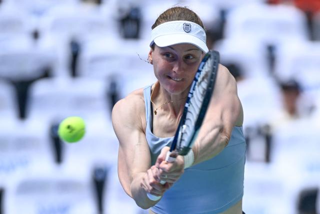 Russia's Liudmila Samsonova hits a return to Czech Republic's Katerina Siniakova during their women's singles match at the Wuhan Open tennis tournament in Wuhan, China's Hubei province on October 13, 2026. (Photo by WANG Zhao / AFP)