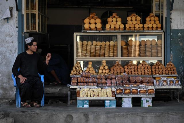 An Afghan vendor waits for customers at a bakery in Kandahar on October 13, 2026. (Photo by Sanaullah SEIAM / AFP)