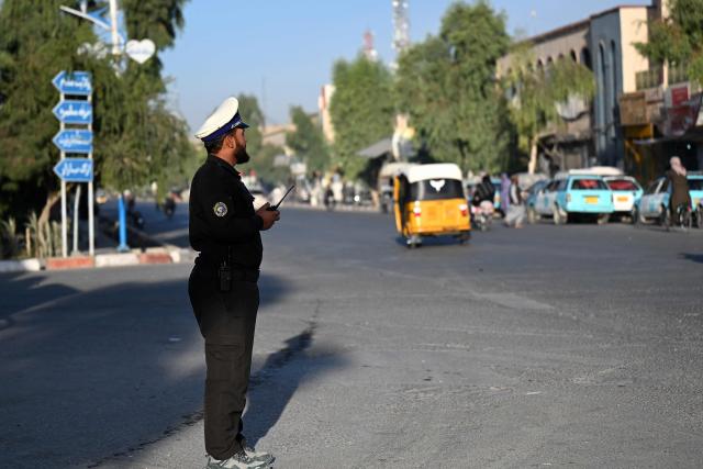 An Afghan traffic personnel stands at a square in Kandahar on October 13, 2026. (Photo by Sanaullah SEIAM / AFP)