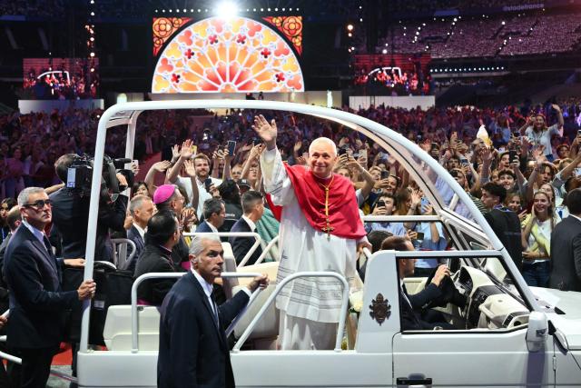 (FILES) Pope Leo XIV greets worshippers from the Papamobile (popemobile) at the Stade de France stadium, in Saint-Denis on the outskirts of Paris on September 25, 2026 as he arrives to lead a prayer vigil with young people, as part of his four days visit to France. Pope Leo XIV will be admitted to hospital on October 13, 2026 for an operation to remove a lump from his lung, the Vatican said. The 71-year-old Leo announced on October 11, 2026 after his weekly prayers that he would undergo an operation "in the coming days". (Photo by Alberto PIZZOLI / AFP)