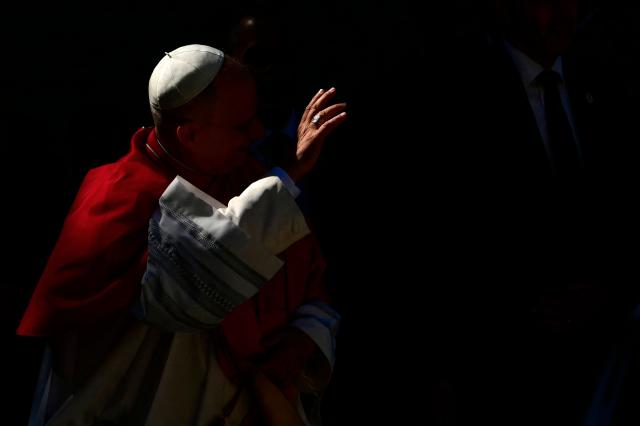 (FILES) Pope Leo XIV greets the crowd as he arrives at San Marino's basilica during a pastoral visit to San Marino on August 22, 2026. Pope Leo XIV will be admitted to hospital on October 13, 2026 for an operation to remove a lump from his lung, the Vatican said. The 71-year-old Leo announced on October 11, 2026 after his weekly prayers that he would undergo an operation "in the coming days". (Photo by Stefano RELLANDINI / AFP)