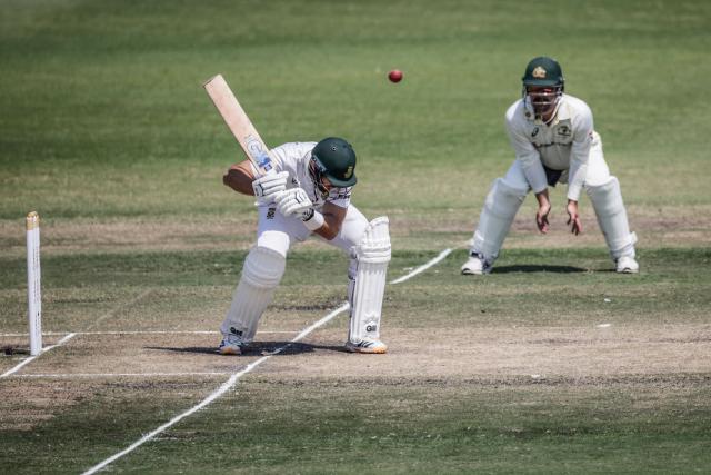 TOPSHOT - South Africa's Aiden Markram ducks under a ball on day five of the first Test match between South Africa and Australia at the Kingsmead stadium in Durban on October 13, 2026. (Photo by Marco Longari / AFP)