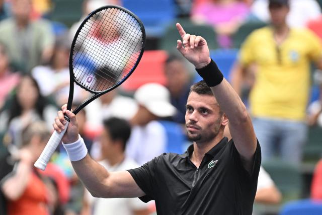 France’s Arthur Gea celebrates after beating Czech Republic’s Jakub Mensik in their men's singles match at the Shanghai Masters tennis tournament in Shanghai on October 13, 2026. (Photo by CN-STR / AFP) / China OUT