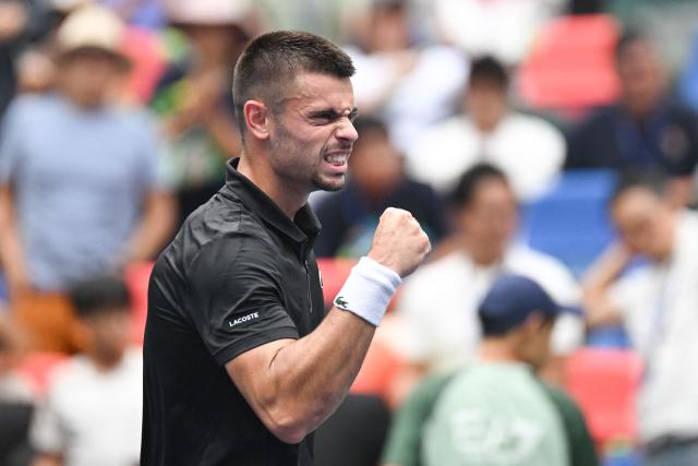 France’s Arthur Gea celebrates after beating Czech Republic’s Jakub Mensik in their men's singles match at the Shanghai Masters tennis tournament in Shanghai on October 13, 2026. (Photo by CN-STR / AFP) / China OUT