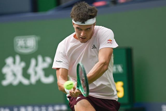 Czech Republic’s Jakub Mensik hits a return to France’s Arthur Gea during their men's singles match at the Shanghai Masters tennis tournament in Shanghai on October 13, 2026. (Photo by CN-STR / AFP) / China OUT