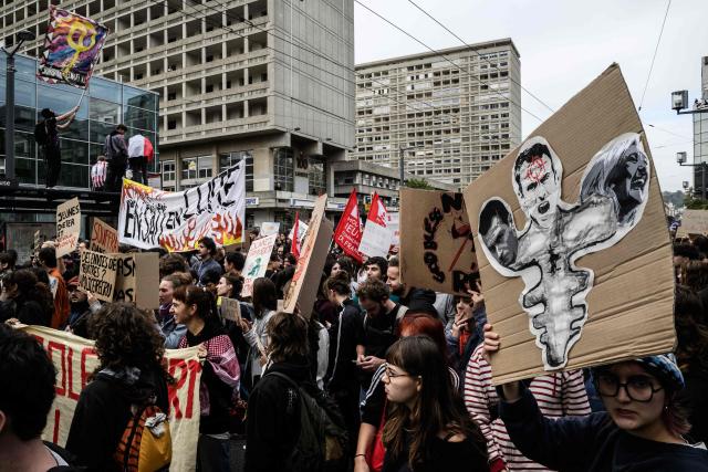 Protesters hold placards and banners during a demonstration of high-school students in Lyon, southeastern France on October 13, 2026, as part of a nationwide high school mobilisation. France sees nationwide demonstrations on October 13 in support of students protesting poor classroom conditions for weeks, as authorities and participants remain wary of further violence. (Photo by JEFF PACHOUD / AFP)